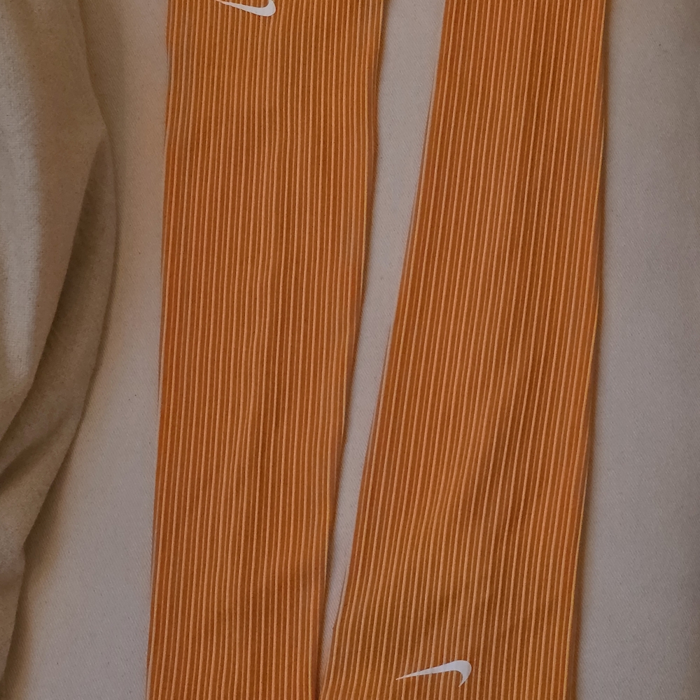 Nike Orange and White Sleeves with White Swoosh Details.